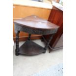 A VICTORIAN OAK CARVED CORNER TABLE WITH LATER TOP ON BOBBIN TURNED LEGS