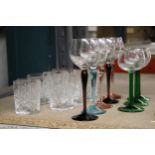 A QUANTITY OF WINE GLASSES WITH COLOURED STEMS AND CUT GLASS TUMBLERS