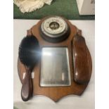 A VINTAGE OAK HALL MIRROR WITH BAROMETER AND BRUSH