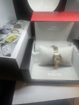 A BOXED TISSOT PR100 WRIST WATCH WITH CHROME AND YELLOW METAL STRAP WITH PEARLISED FACE