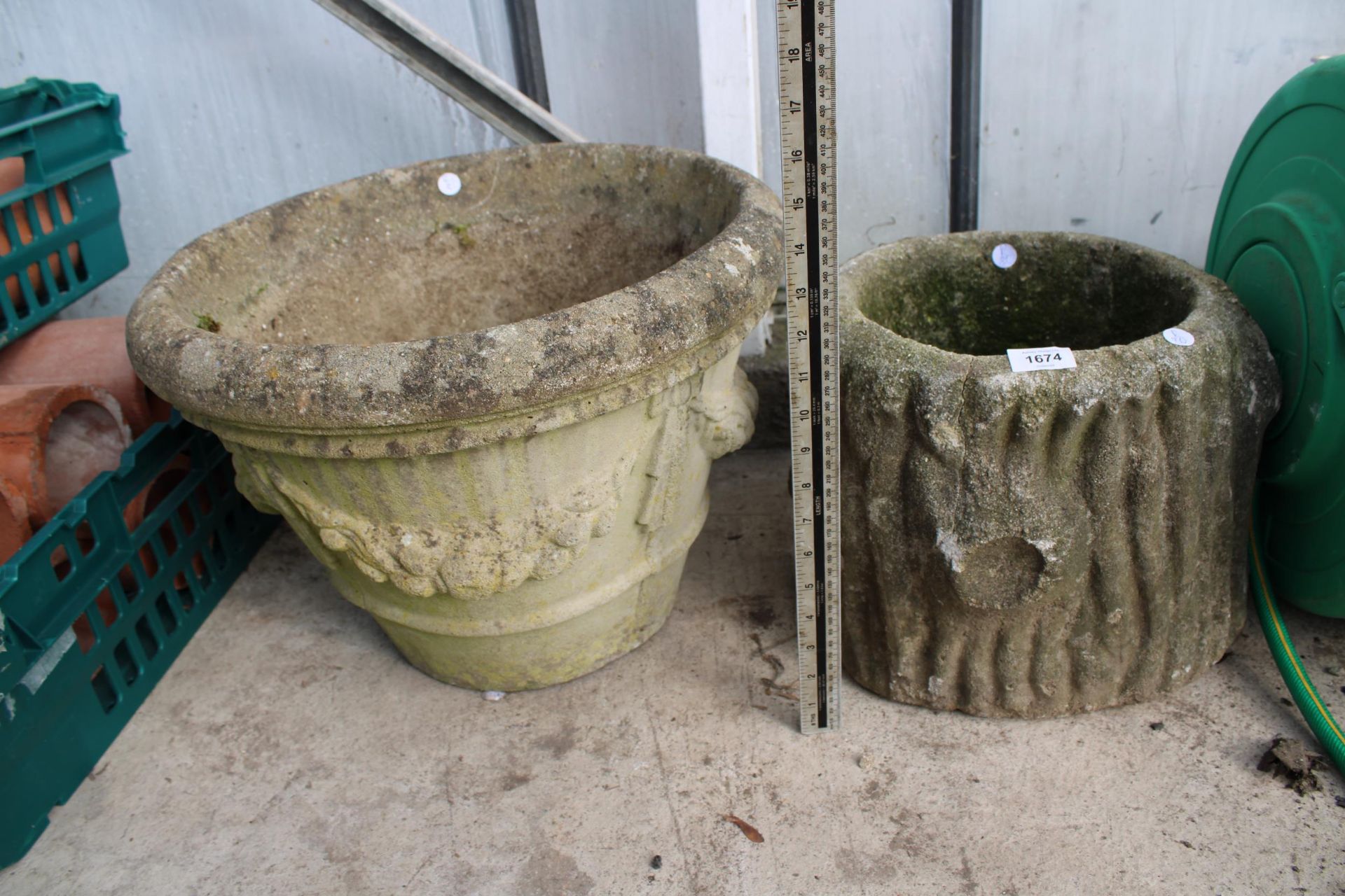 TWO DECORATIVE CONCRETE GARDEN PLANTERS