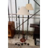 A COLLECTION OF LAMPS TO INCLUDE A WOODEN STANDARD LAMP WITH SHADE AND TWO FURTHER WROUGHT IRON