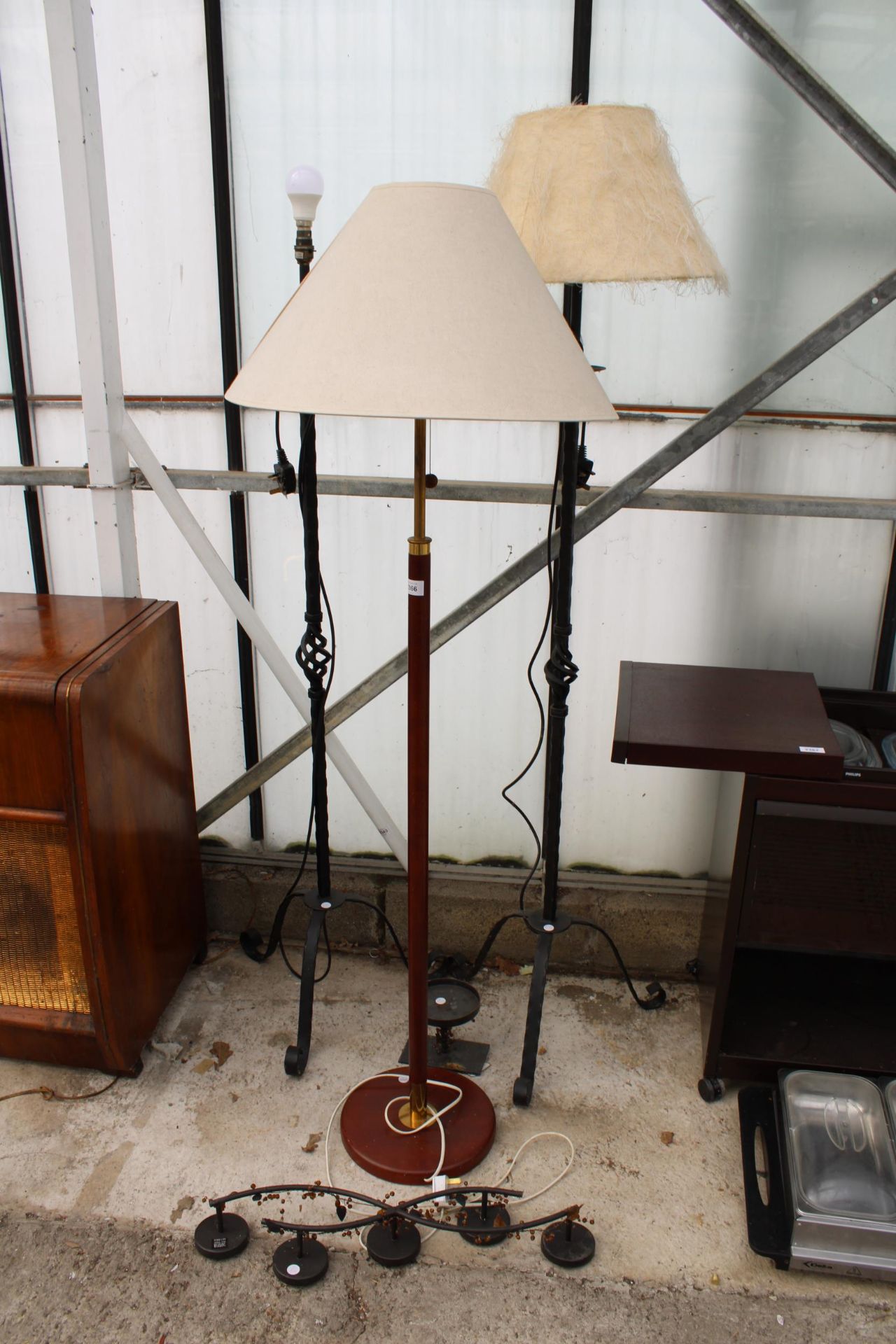 A COLLECTION OF LAMPS TO INCLUDE A WOODEN STANDARD LAMP WITH SHADE AND TWO FURTHER WROUGHT IRON