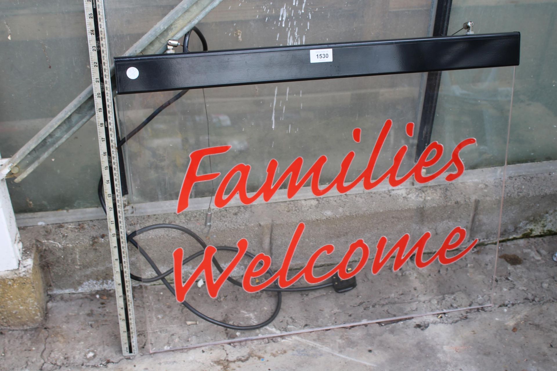 AN ILLUMINATED 'FAMILIES WELCOME' SIGN BELIEVED IN WORKING ORDER BUT NO WARRANTY, FROM FRANKIE AND