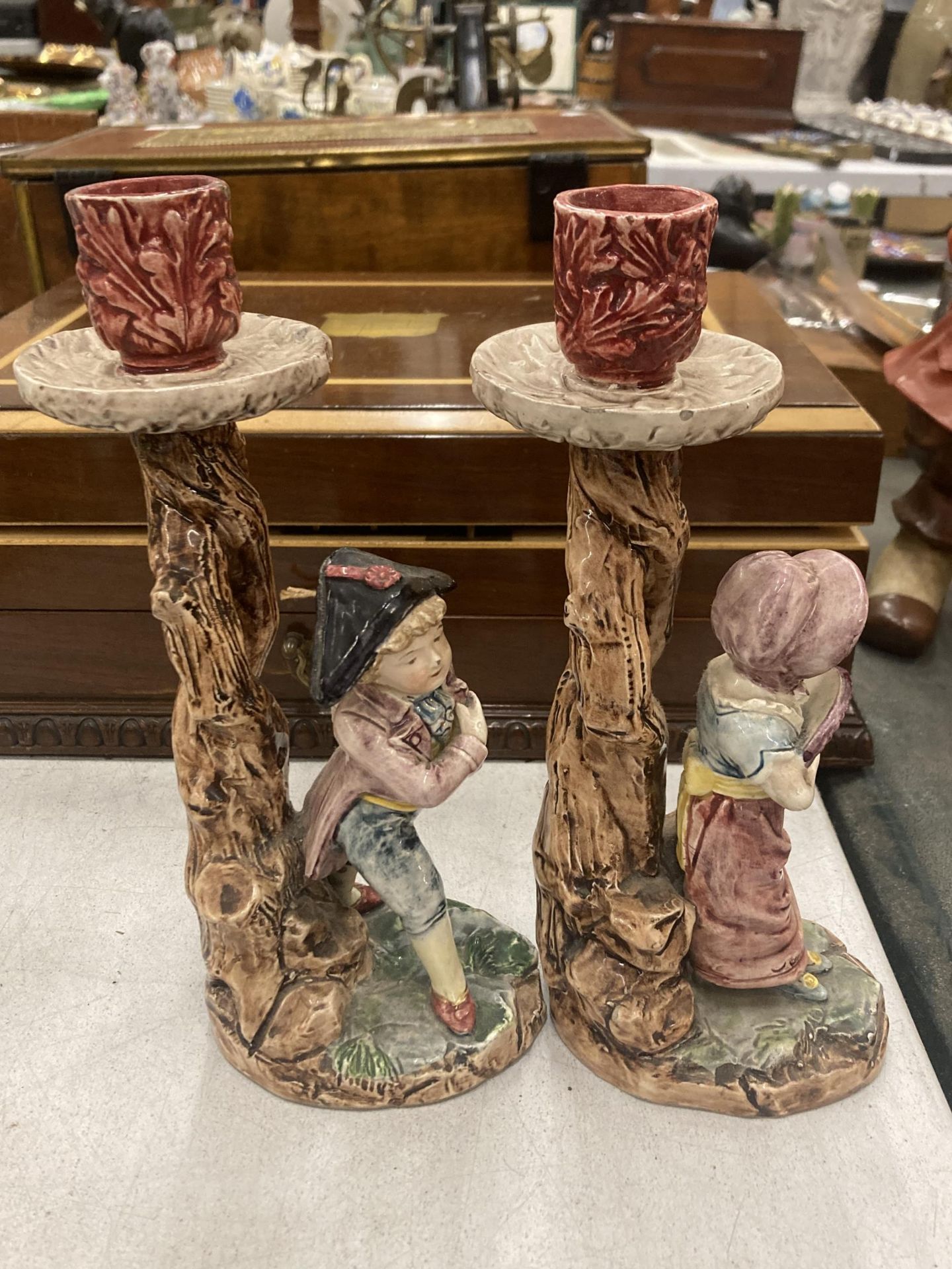 A PAIR OF CERAMIC CANDLE HOLDERS DEPICTING A BOY AND A GIRL - Image 2 of 3