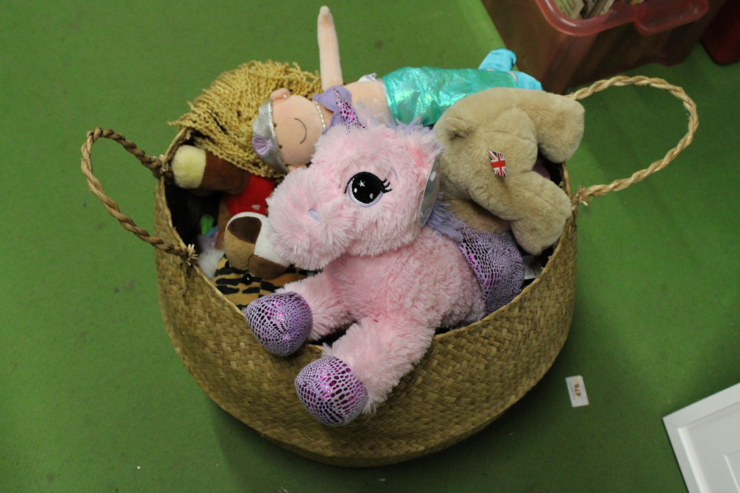 A BASKET CONTAINING A QUANTITY OF SOFT TOYS SOME WITH TAGS