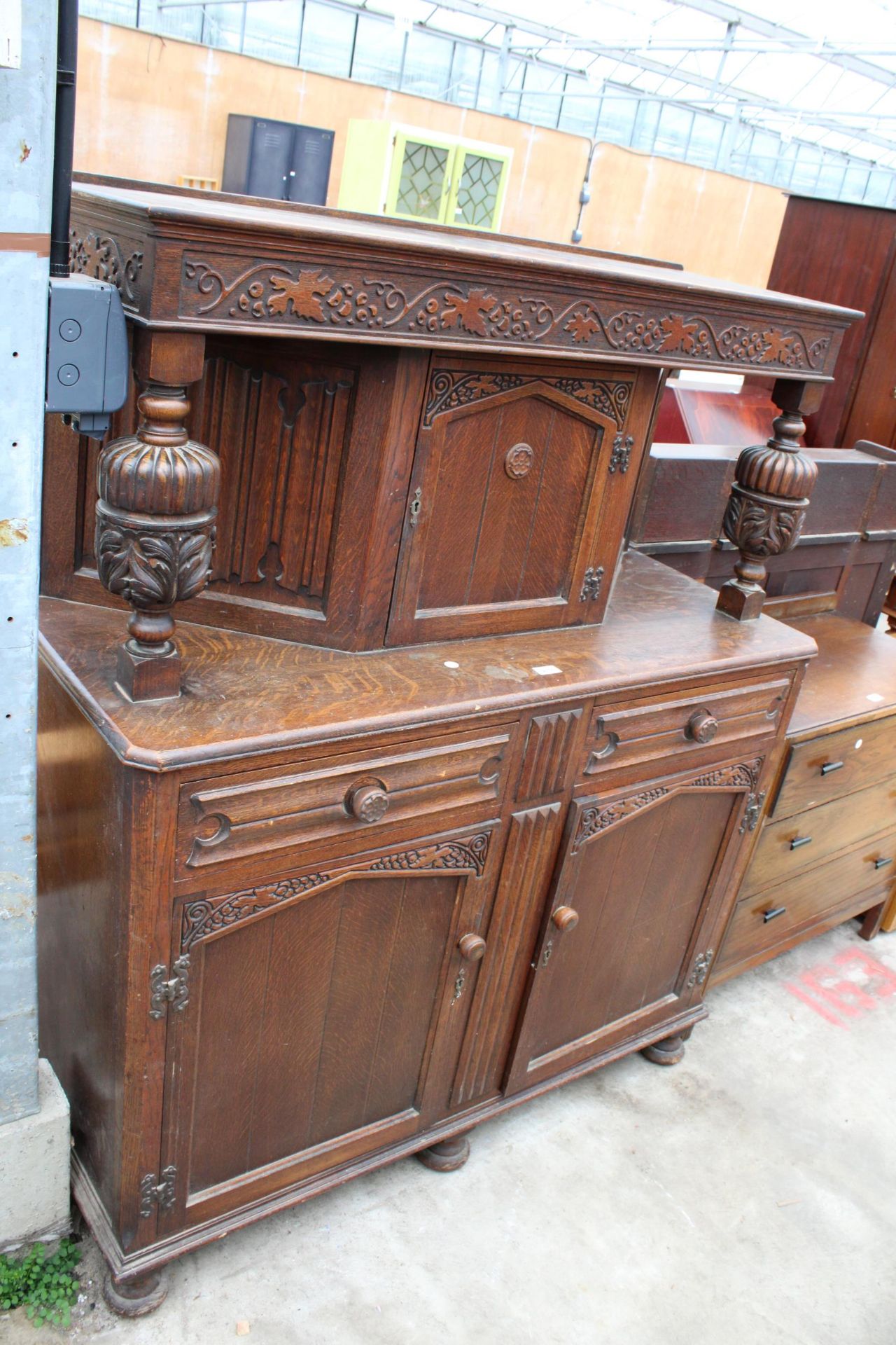 A MID 20TH CENTURY OAK COURT CUPBOARD