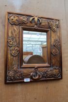 A BRONZE EFFECT WALL MIRROR 19" X 17"