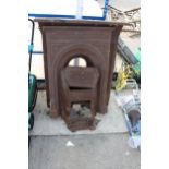 TWO VINTAGE CAST IRON FIRE SURROUNDS