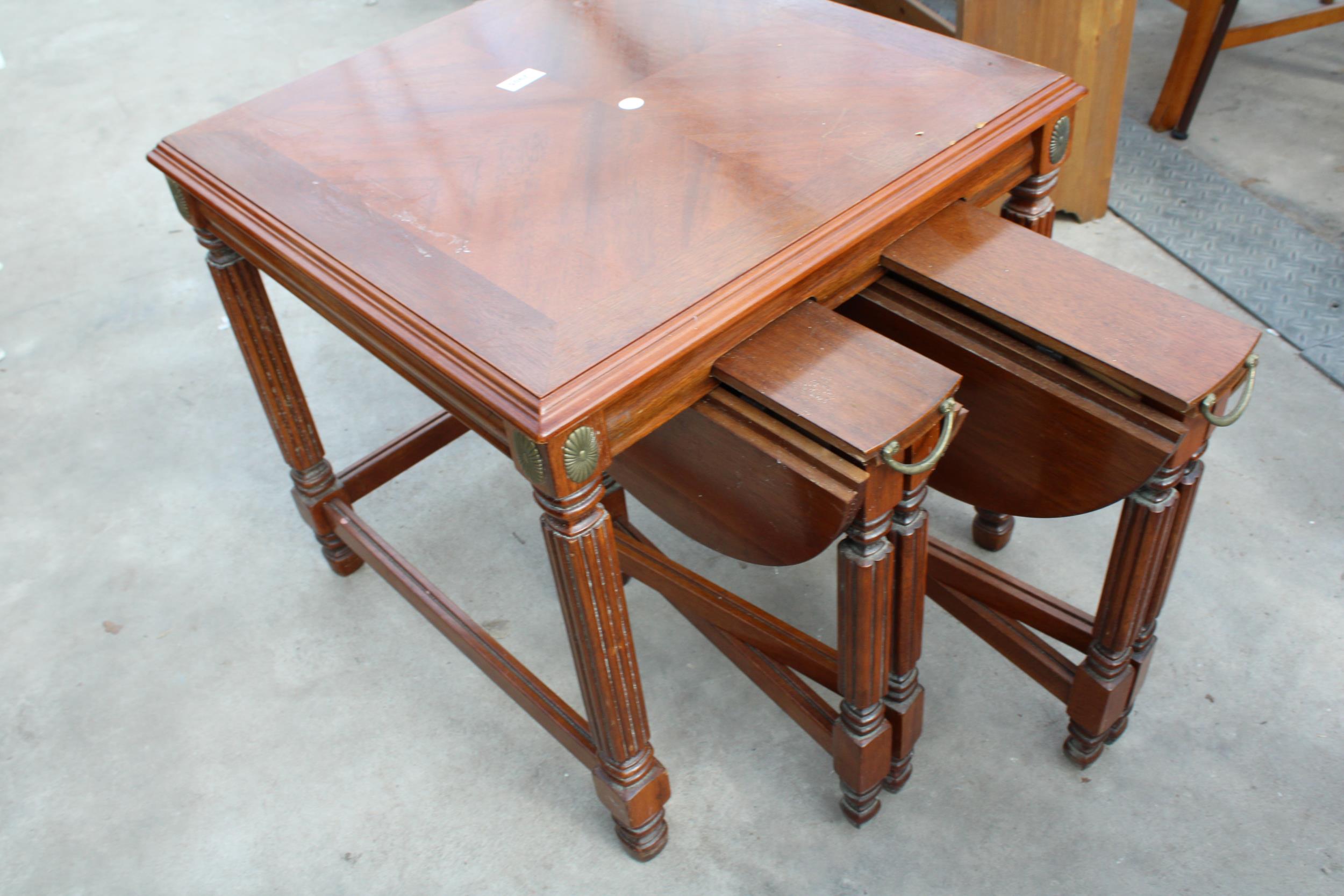 A HARDWOOD NEST OF THREE TABLES , TWO BEING DROP LEAF 17" DIAMETER - Image 3 of 3