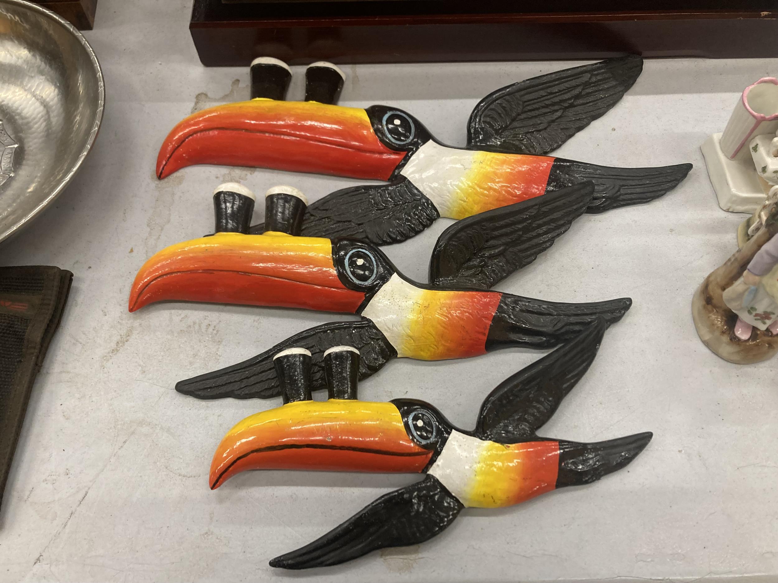 A FLIGHT OF RESIN TOUCANS