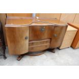 A MID 20TH CENTURY WALNUT BEAUTILITX SIDEBOARD/COCKTAIL CABINET 54" WIDE