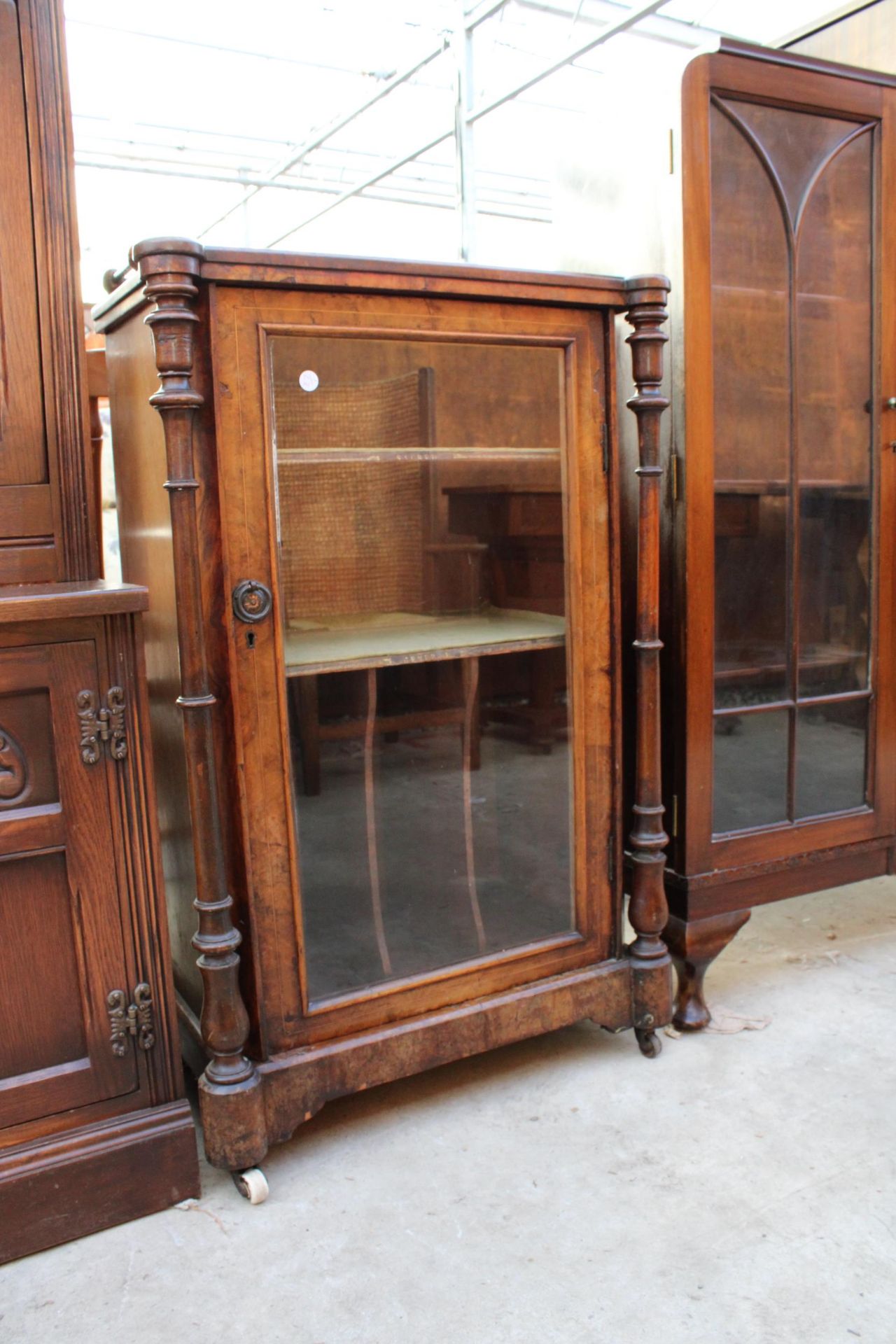 A VICTORIAN WALNUT MUSIC CABINET WITH GLASS DOOR, TURNED UPRIGHTS AND GALLERY BACK 23" WIDE - Image 2 of 3