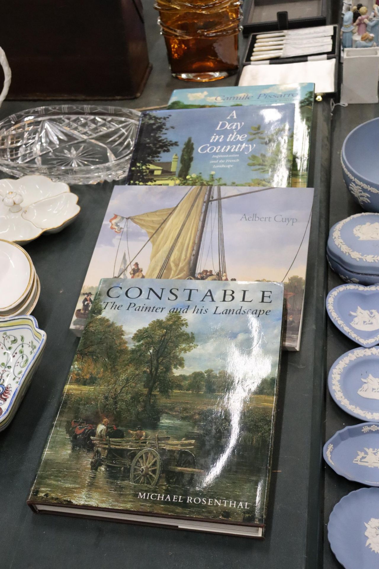 FOUR HARDBACK ART THEMED BOOKS TO INCLUDE CONSTABLE, AELBERT CUYP, A DAY IN THE COUNTRY AND