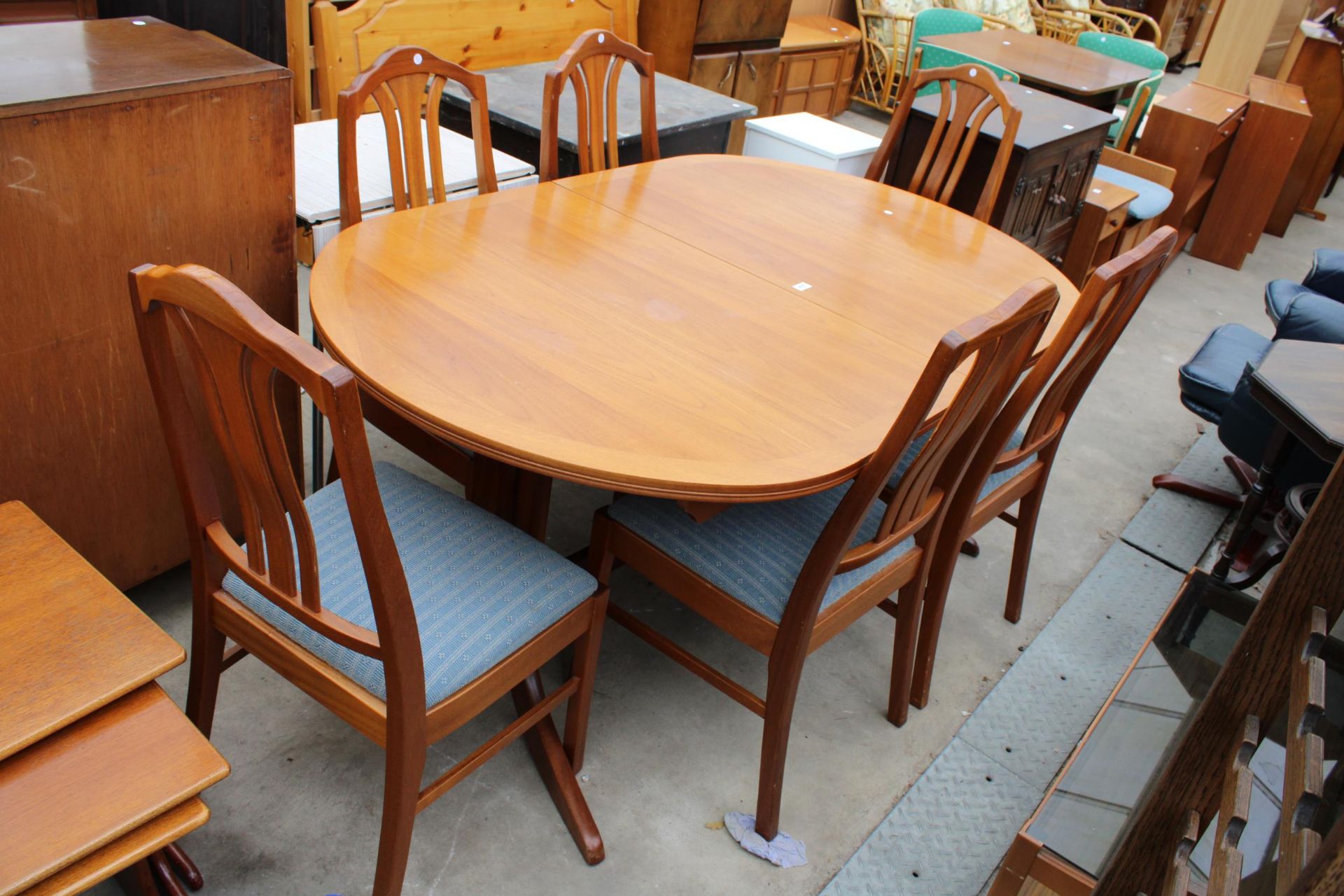 A NATHAN RETRO TEAK EXTENDING DINING TABLE 64" X 41" (LEAF 18") ON WHALE FIN LEGS AND SIX DINING