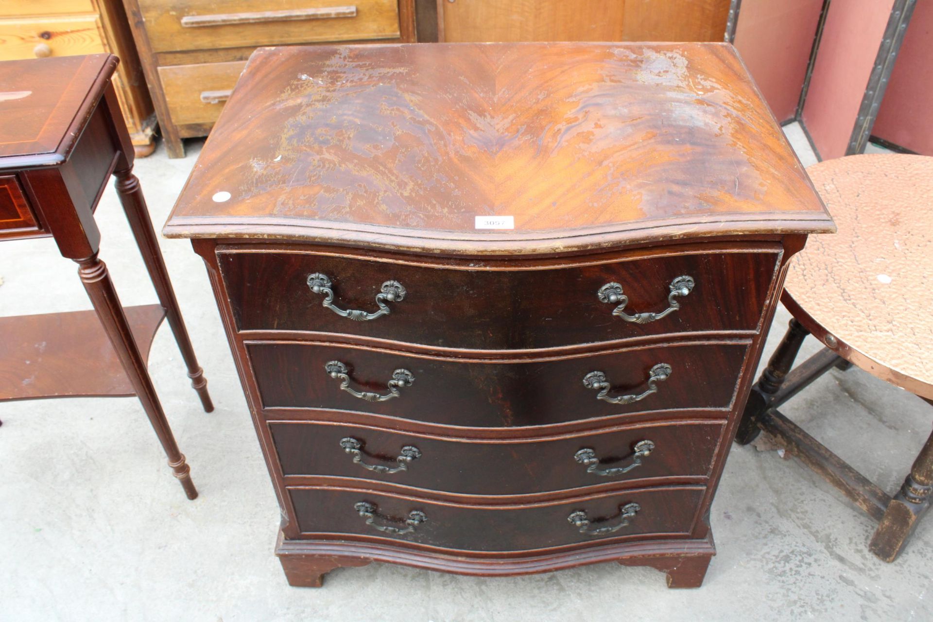 A REPRODUCTION MAHOGANY SERPENTINE CHEST OF FOUR DRAWERS, 28" WIDE