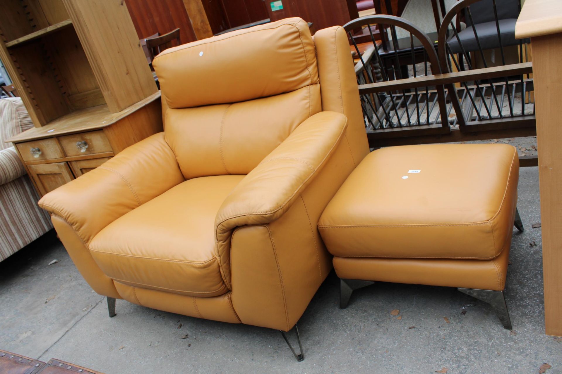 A MUSTARD EASY CHAIR AND STOOL ON KICK OUT METAL LEGS