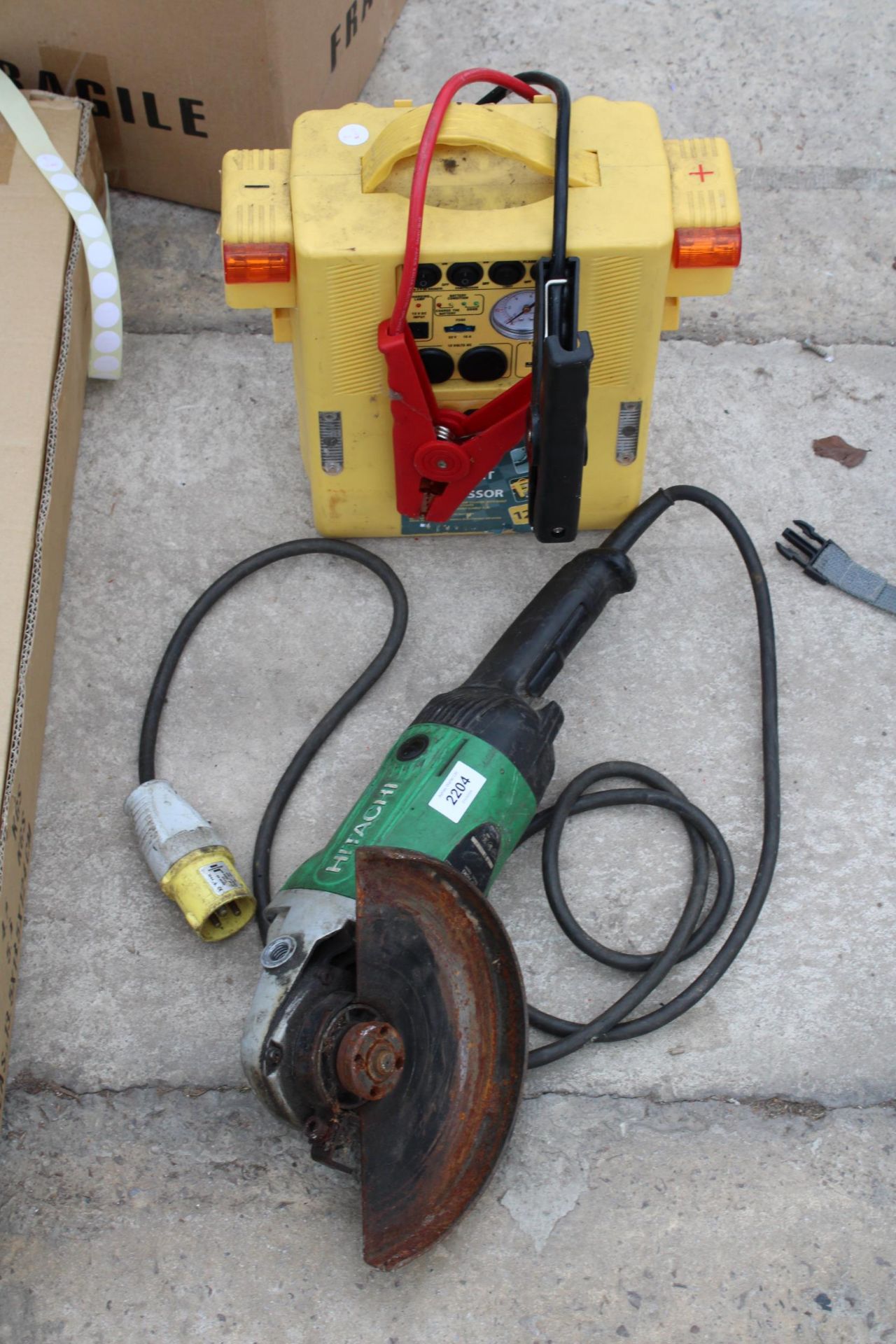 AN HITACHI ELECTRIC ANGLE GRINDER AND A JUMP STARTER PACK