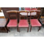 THREE VICTORIAN MAHOGANY DINING CHAIRS ON TURNED AND FLUTED LEGS