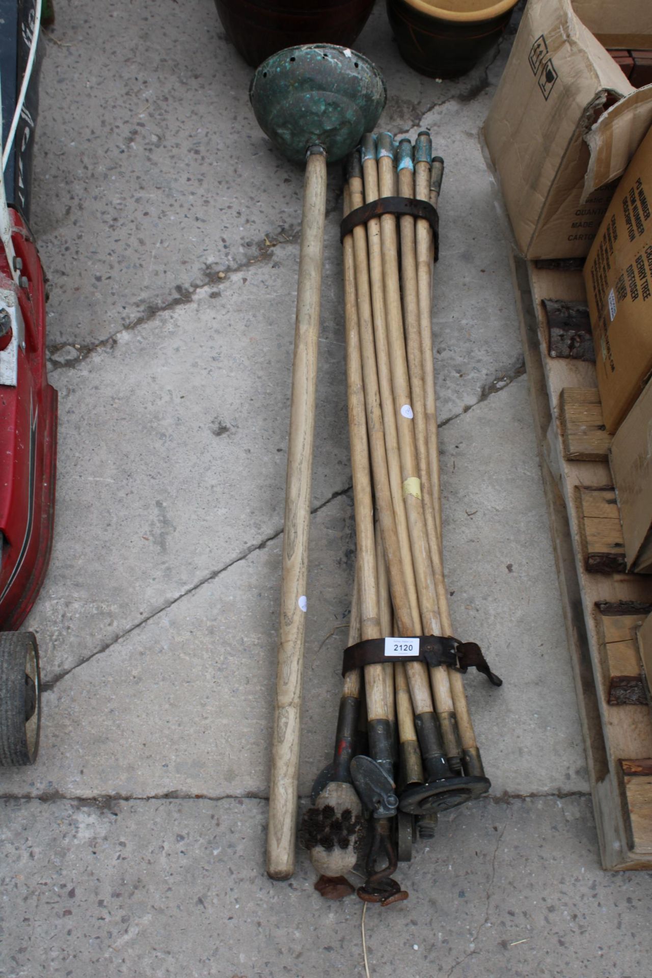 A SET OF DRAINING RODS AND A DOLLY POSSER