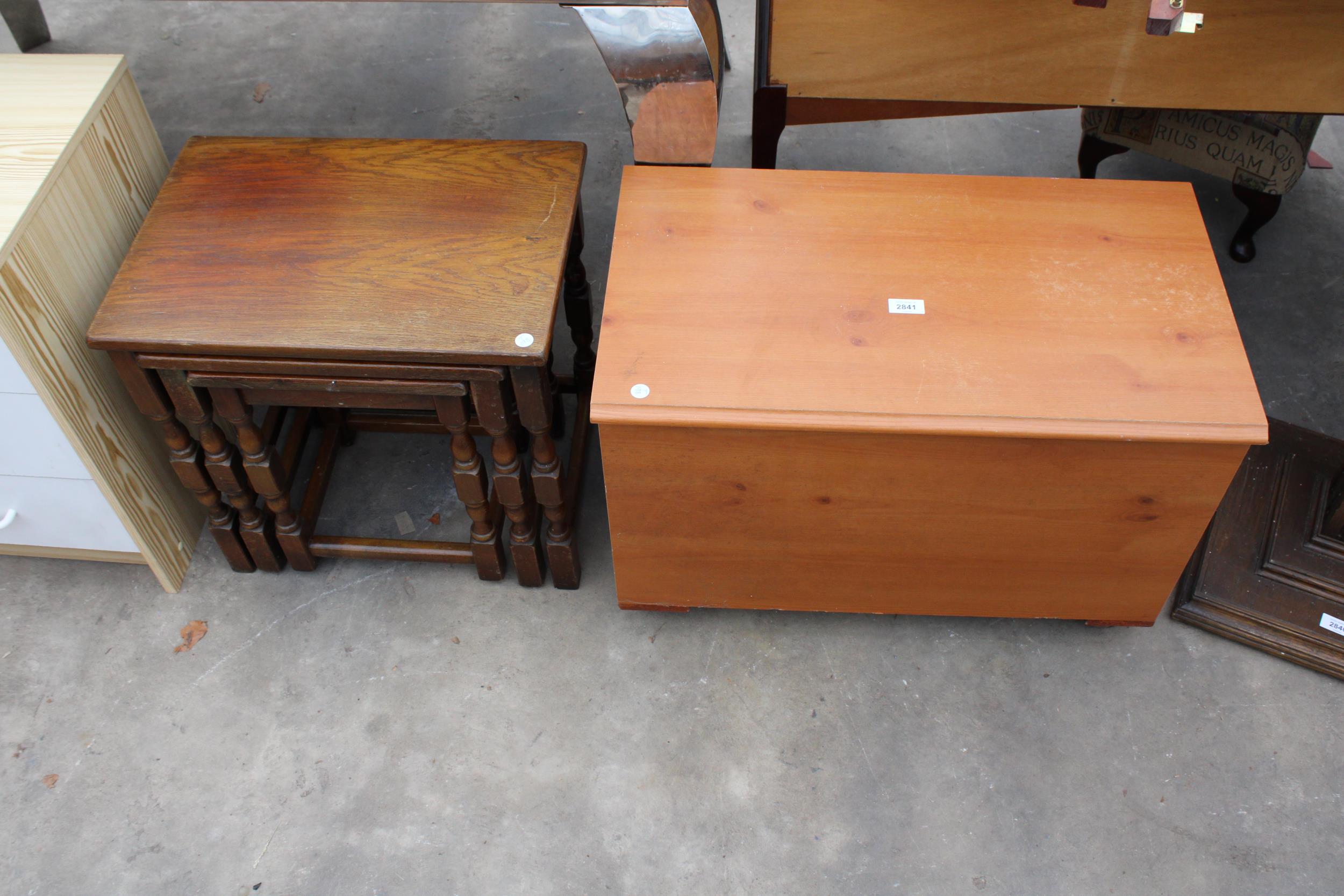 A MODERN BLANKET CHEST AND NEST OF TABLES