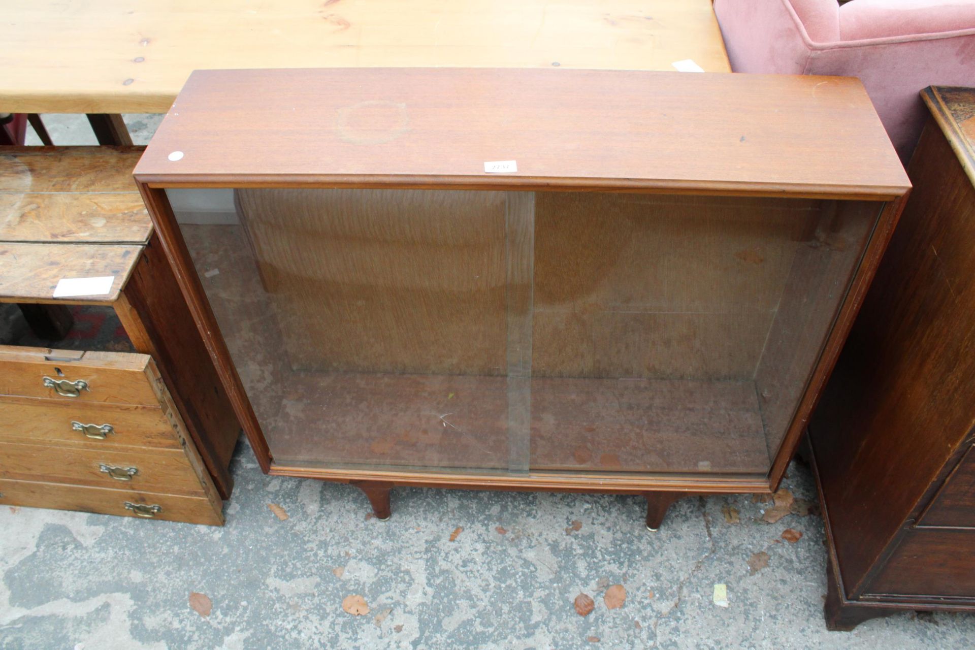 A RETRO TEAK BOOKCASE WITH SLIDING GLASS DOORS 38" WIDE