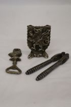 A GRYPHON DOOR STOP TOGETHER WITH A KNIGHT BOTTLE OPENER AND VICTORIAN NUT CRACKER