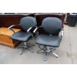 A PAIR OF BLACK FAUX LEATHER BARBERS STYLE SWIVEL PUMP CHAIRS ON POLISHED CHROME BASE WITH SWEPT