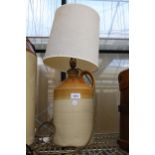 A VINTAGE STONEWARE FLAGGON TABLE LAMP WITH SHADE