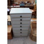 A PAINTED VICTORIAN PINE CHEST OF SEVEN GRADUATED WITH SLOPING TOP 27" WIDE