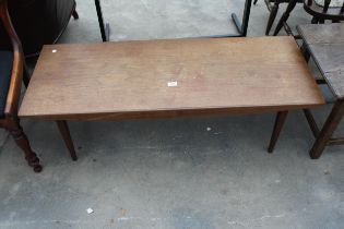 A RETRO TEAK COFFEE TABLE ON TAPERING LEGS 48" X 18"