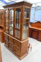 A HARDWOOD BOOKCASE ON BASE 52" WIDE