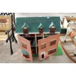 A LARGE WOODEN DOLLS HOUSE WITH A LARGE QUANTITY OF DOLLS HOUSE FURNITURE