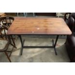 A PINE TABLE WITH ROUNDED CORNERS ON A METALWORK BASE 48" X 25"