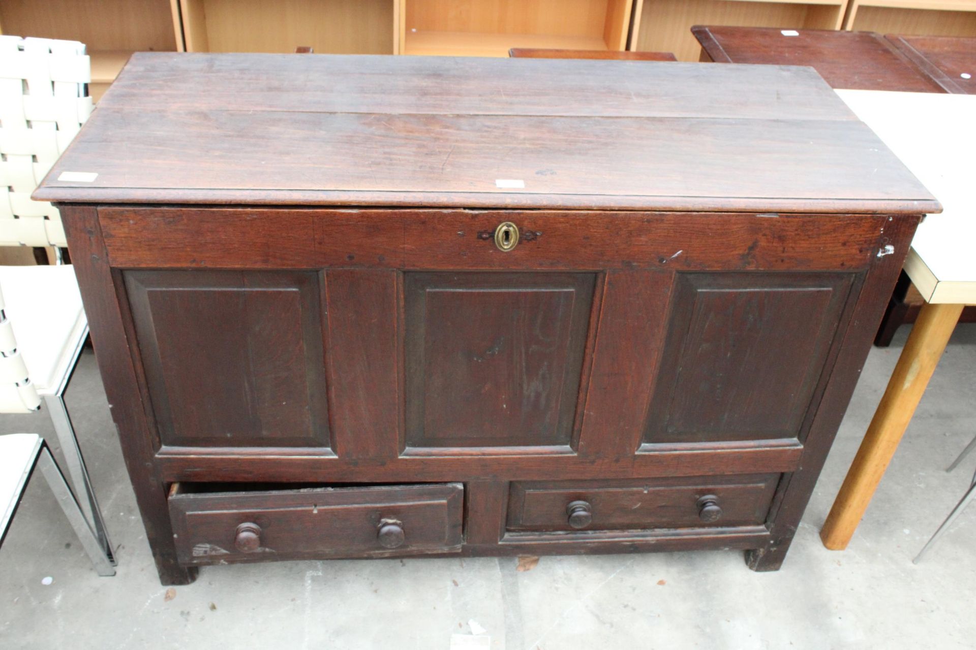 A GEORGE II OAK LANCASHIRE CHEST WITH TWO DRAWERS TO BASE AND A THREE PANEL FRONT 52" WIDE