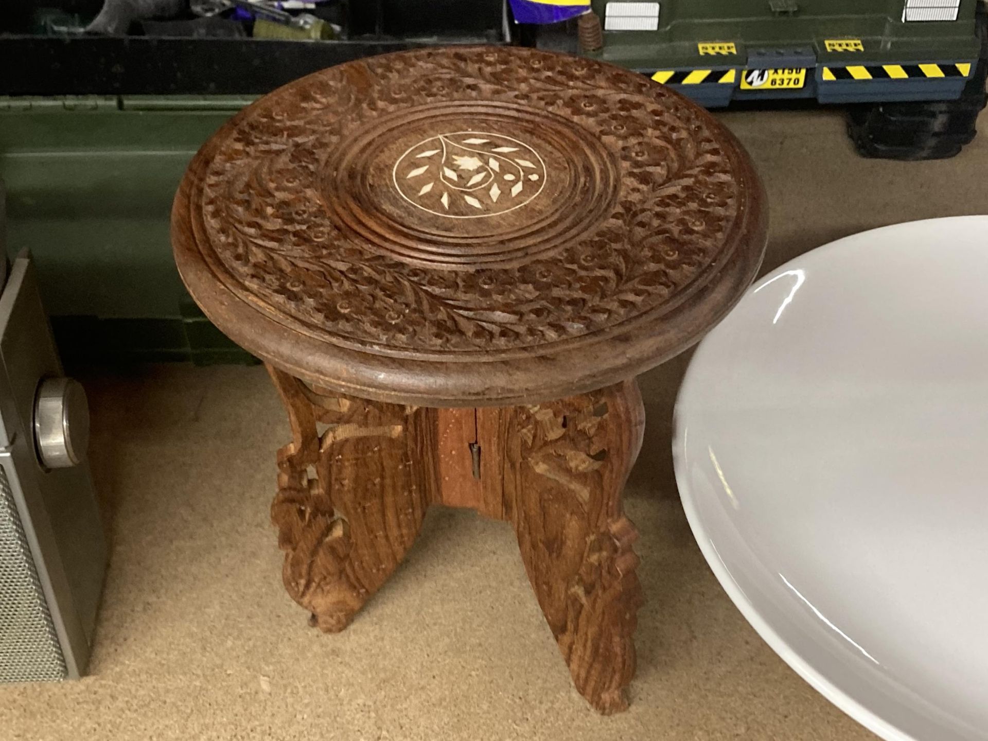 A CARVED INDIAN WOOD TABLE HEIGHT APPROXIMATELY 25CM - Image 2 of 2