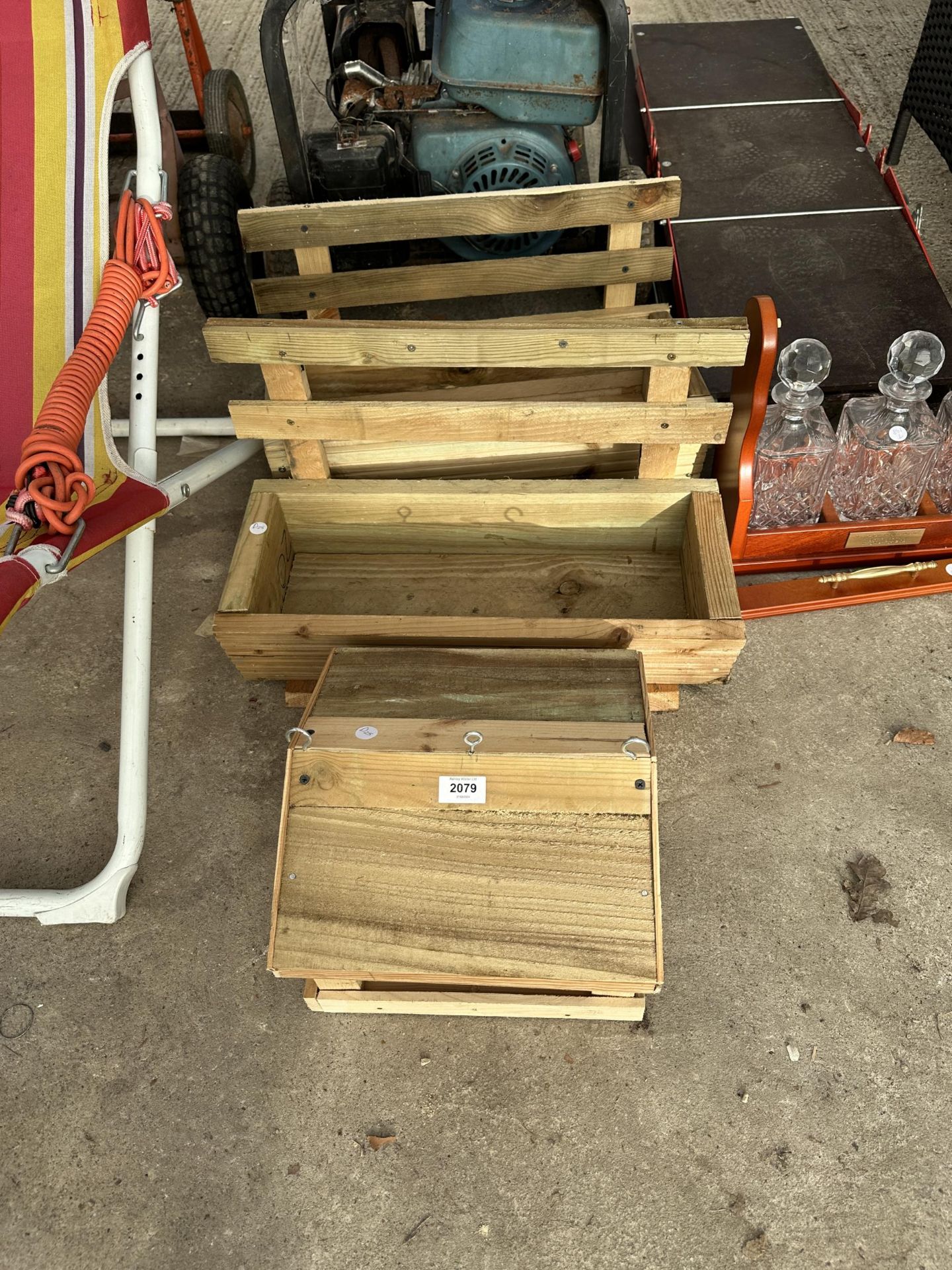 TWO WOODEN TROUGH PLANTERS AND A BIRDTABLE TOP