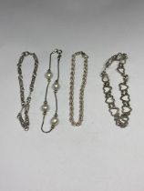 FOUR SILVER BRACELETS