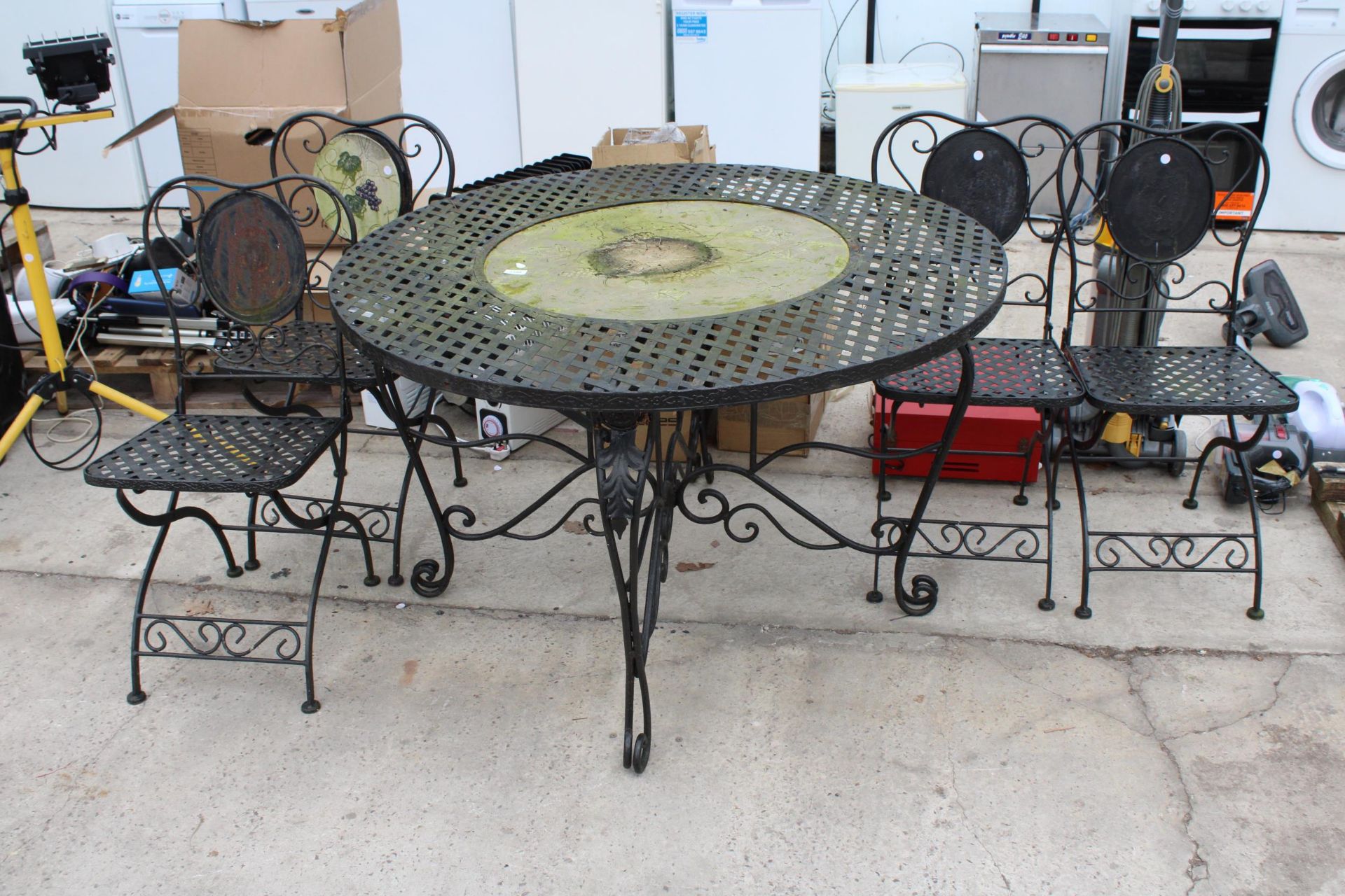A METAL PATIO SET COMPRISING OF A ROUND TABLE AND FOUR CHAIRS