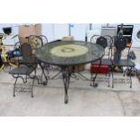 A METAL PATIO SET COMPRISING OF A ROUND TABLE AND FOUR CHAIRS