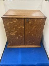 A WEBB AND SON PLYMOUTH EXETER OAK STATIONARY CABINET WITH THREE INTERIOR DRAWERS ENCLOSED WITH