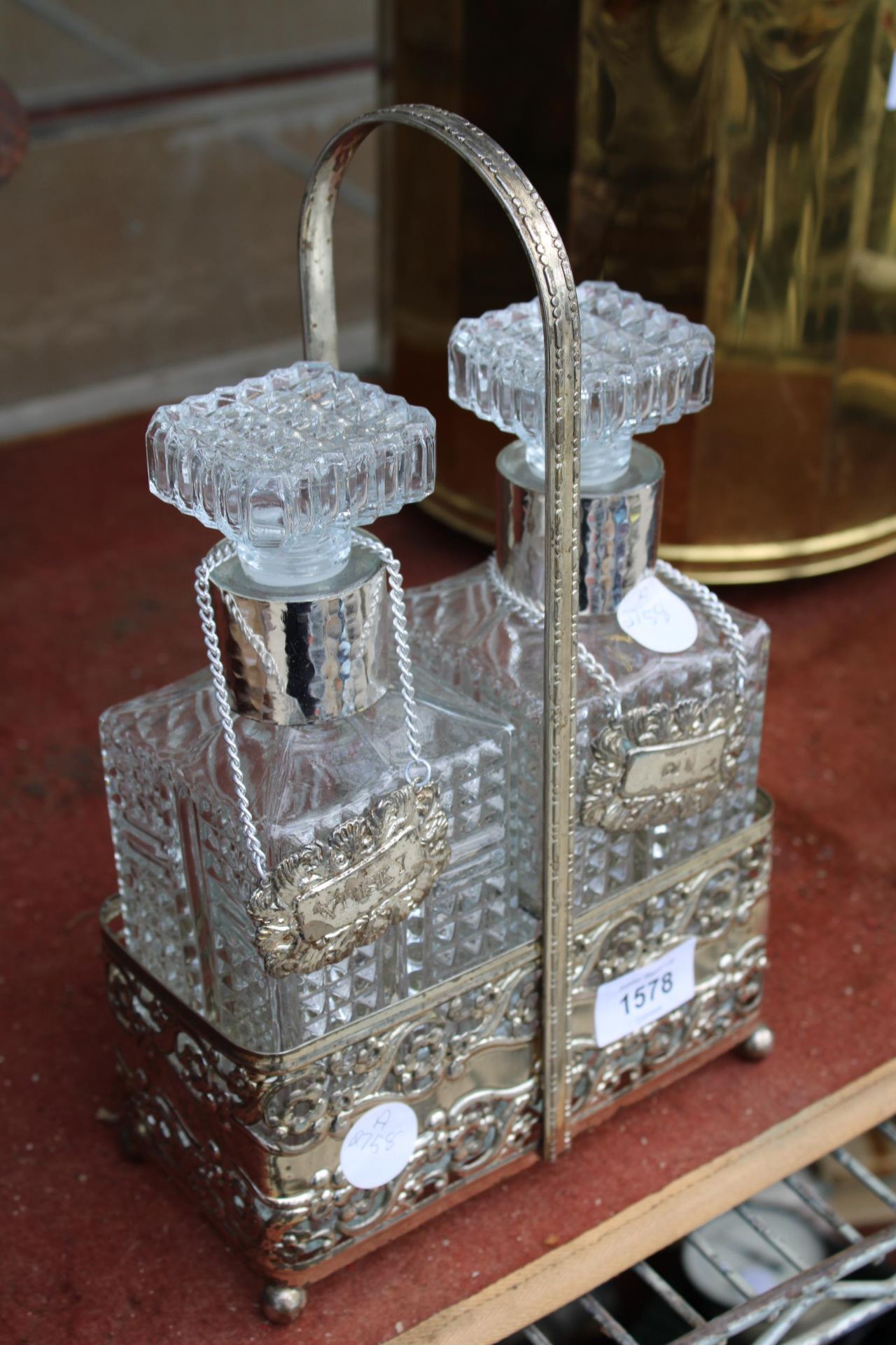 A VINTAGE SILVER PLATED TANTALUS WITH TWO CUT GLASS DECANTORS AND SILVER PLATED LABELS - Image 2 of 2