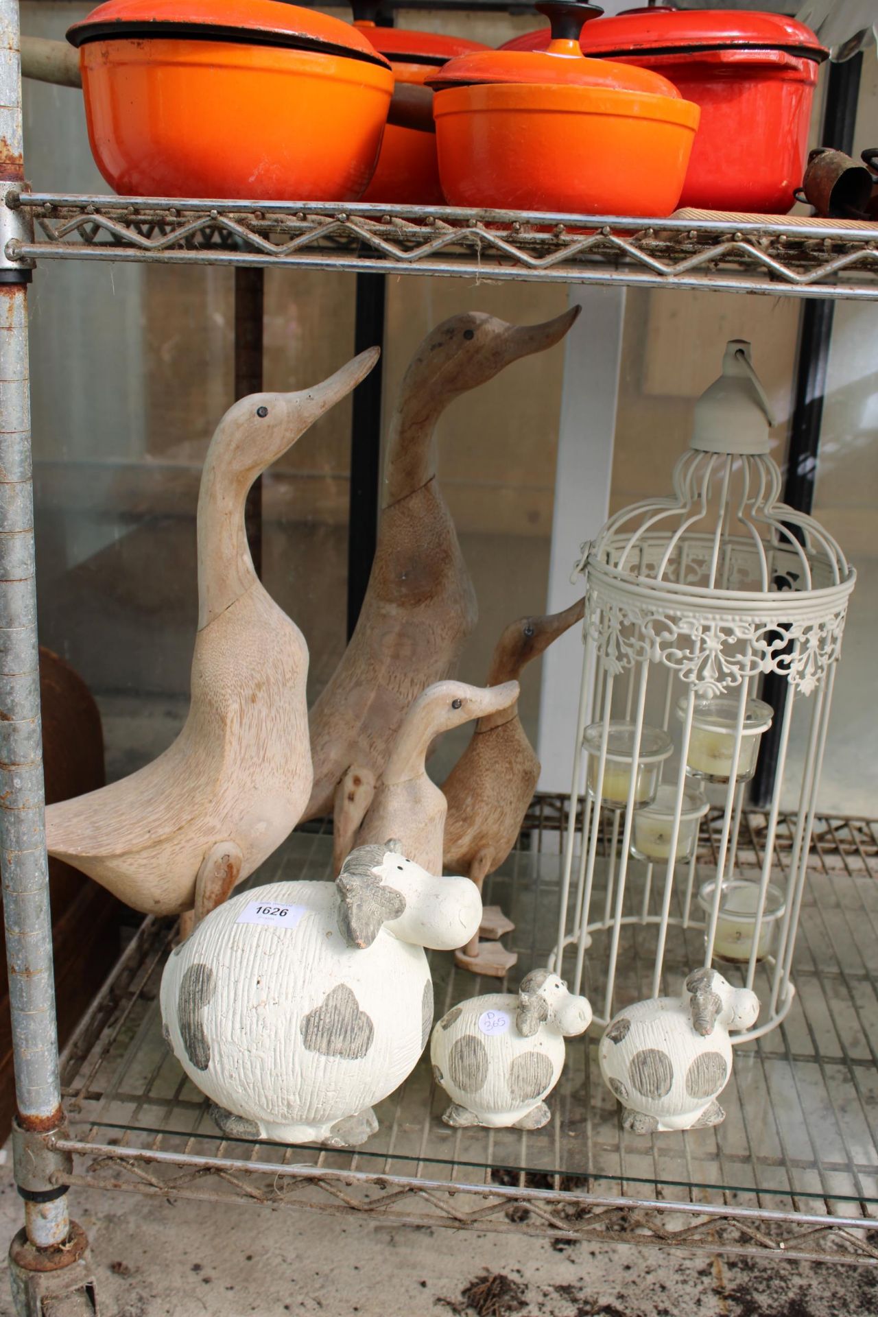 AN ASSORTMENT OF ITEMS TO INCLUDE WOODEN DUCKS, CERAMIC COWS AND A CANDLE LANTERN ETC