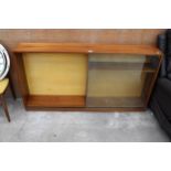 A RETRO TEAK BOOKCASE WITH TWO SLIDING DOORS 59" WIDE