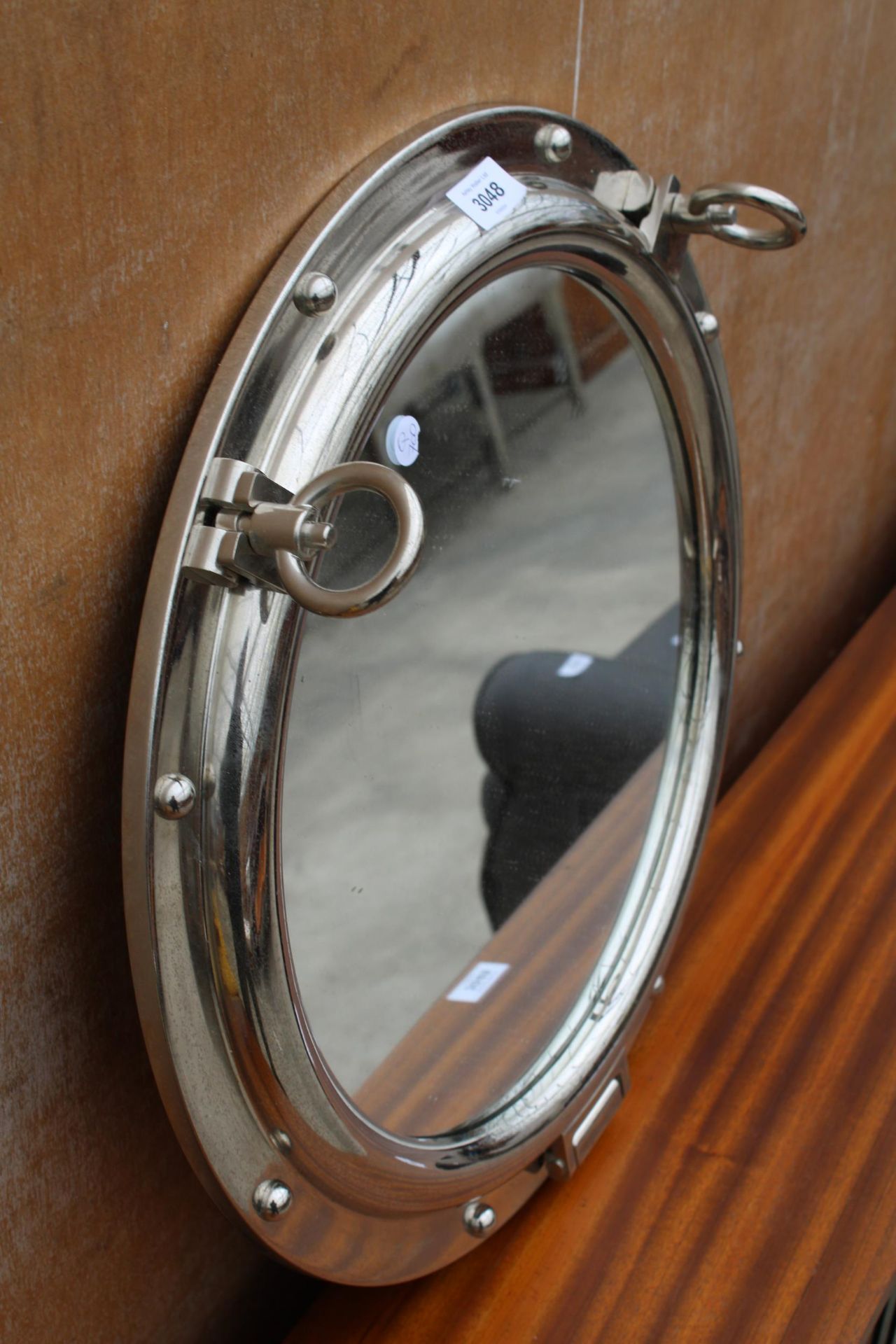 A CHROME WALL MIRROR IN THE FORM OF A PORTHOLE - Image 2 of 2