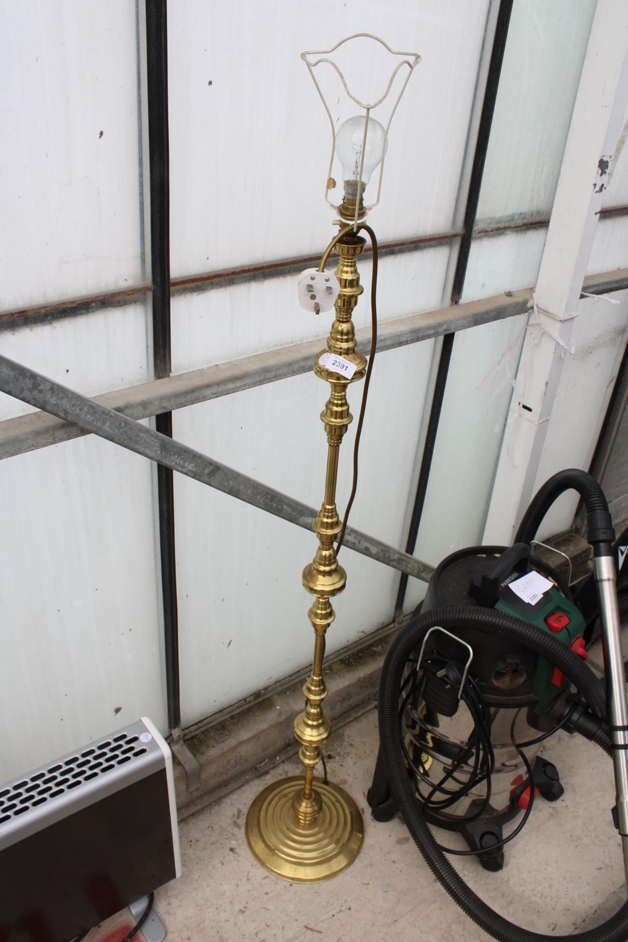 A BRASS STANDARD LAMP