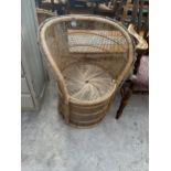 A VINTAGE WICKER BARREL CHAIR