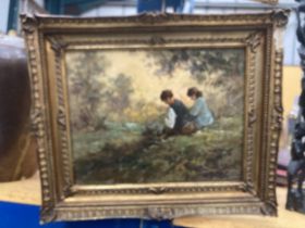 A GILT FRAMED OIL ON BOARD OF TWO CHILDREN BY A RIVER SIGNED 29.5CM X 23CM