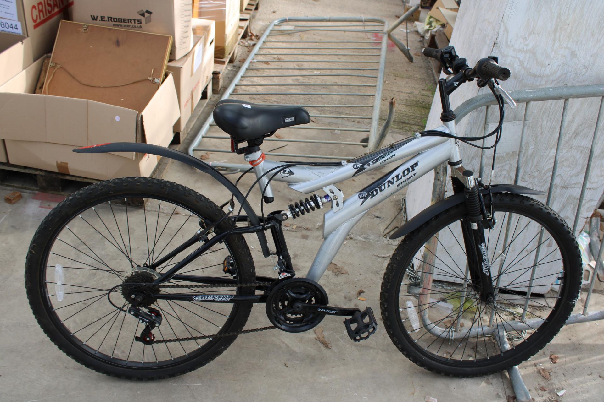 A DUNLOP SPECIAL EDITION MOUNTAIN BIKE WITH FRONT AND REAR SUSPENSION AND 18 SPEED GEAR SYSTEM