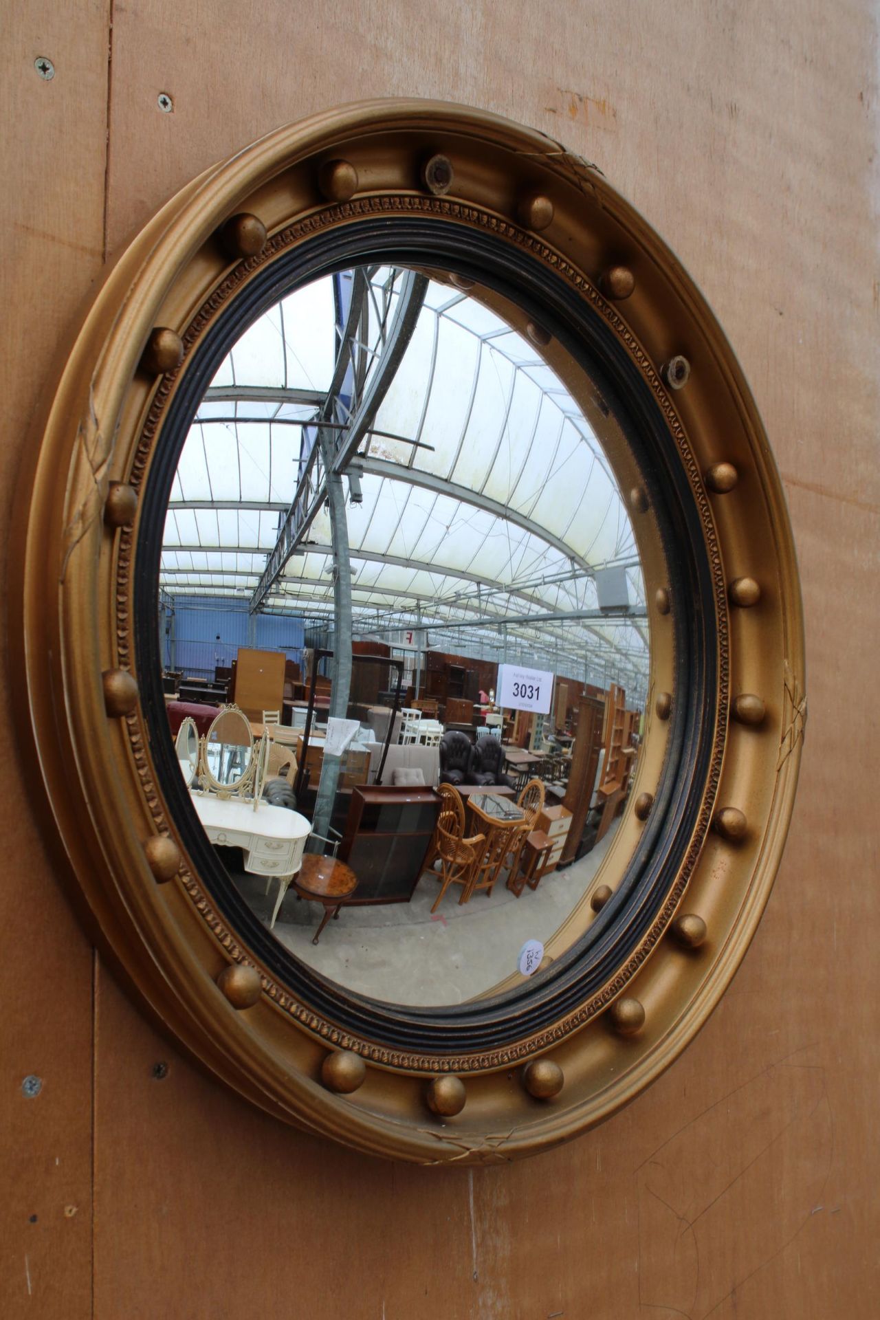 A 19TH CENTURY STYLE GILT FRAMED CONVEX MIRROR - 21" DIAMETER